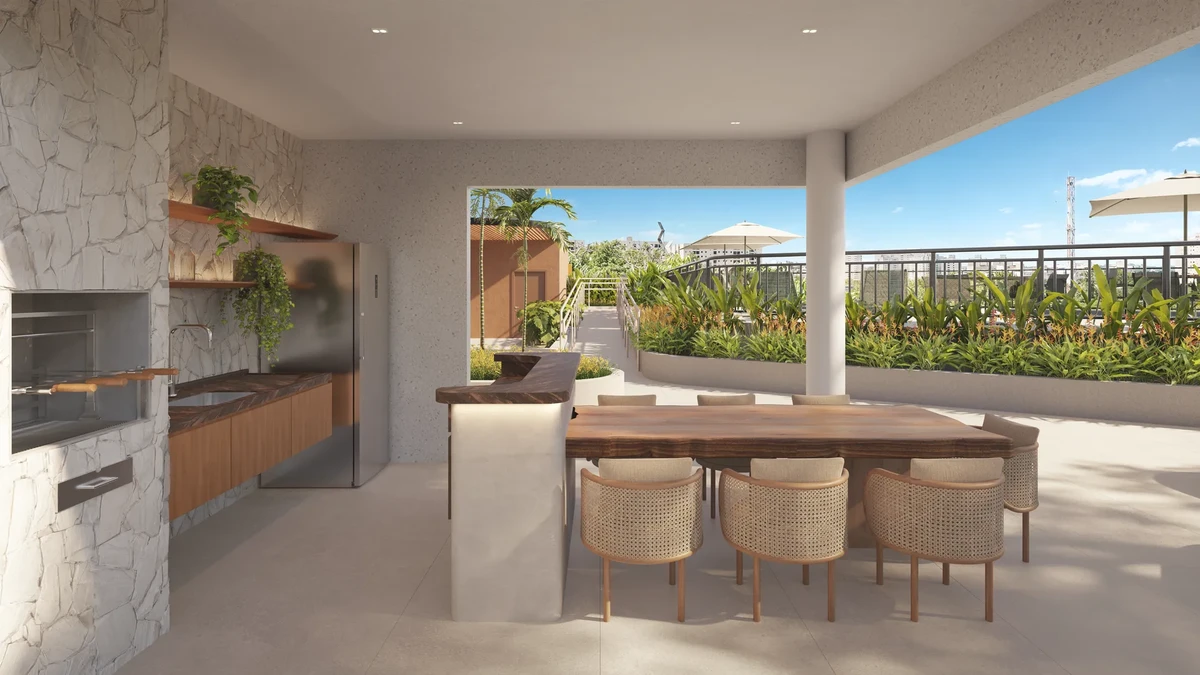 Espaço gourmet externo com mesa comprida e churrasqueira para recepção de convidados do condomínio Inc Green Cambeba da construtora Diagonal.