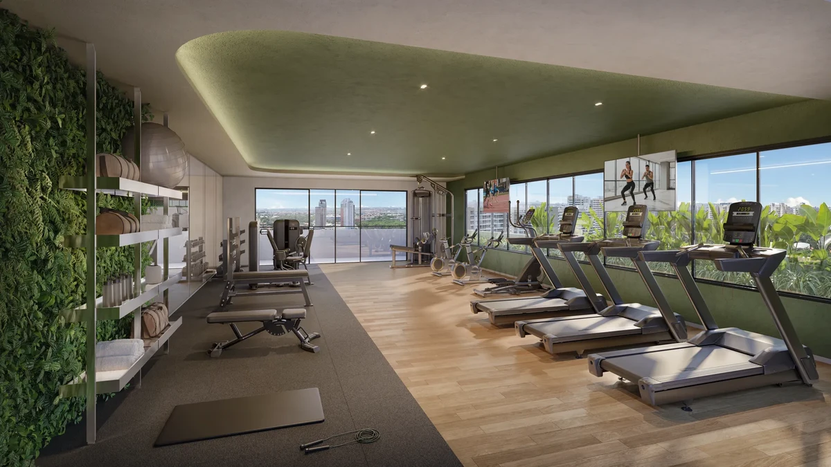 Academia profissional (Fitness Center) do Inc. Green Cambeba, totalmente equipada com esteiras de última geração, musculação e parede verde decorativa.